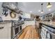 This kitchen features a stainless steel range, granite countertops, and wooden floors at 4770 Hilltop Nw Dr, Acworth, GA 30101