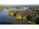 Scenic aerial view of lake and surrounding lush greenery and landscape at 4770 Hilltop Nw Dr, Acworth, GA 30101