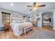 Bright main bedroom with an ensuite bathroom, wood floors, and natural light at 4770 Hilltop Nw Dr, Acworth, GA 30101