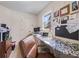 Functional home office with a built-in desk, natural light, and ample workspace at 4770 Hilltop Nw Dr, Acworth, GA 30101