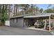 Detached shed features additional carport for vehicle storage or workspace at 4770 Hilltop Nw Dr, Acworth, GA 30101