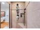 Stylish shower with mosaic tile accents, shower caddy, and a built-in corner bench at 4770 Hilltop Nw Dr, Acworth, GA 30101