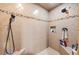 Modern walk-in shower features tiled walls with decorative mosaic trim and dual shower heads at 4770 Hilltop Nw Dr, Acworth, GA 30101