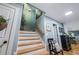 Bright staircase with hardwood steps, neutral walls, and charming decor at 4770 Hilltop Nw Dr, Acworth, GA 30101