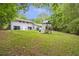 View of the back of the home featuring a backyard play set at 2288 Street Deville Ne, Atlanta, GA 30345