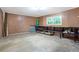 Unfinished basement featuring a concrete floor, pegboard wall, shelving and a window at 2288 Street Deville Ne, Atlanta, GA 30345