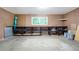 Basement featuring a window, concrete floor, shelving and pegboard wall at 2288 Street Deville Ne, Atlanta, GA 30345