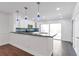 Bright and airy kitchen boasting a breakfast bar, white cabinets, and stainless steel appliances, perfect for everyday living at 2288 Street Deville Ne, Atlanta, GA 30345