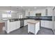 Modern kitchen with stainless steel appliances, white cabinets, and a kitchen island, perfect for cooking and entertaining at 2288 Street Deville Ne, Atlanta, GA 30345