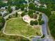 Aerial view of a community park with a playground and walking trails surrounded by trees at 329 Lakebridge Xing, Canton, GA 30114