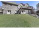 A lush green backyard with a patio and exterior door at 329 Lakebridge Xing, Canton, GA 30114