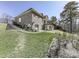 A lush green backyard with a patio and exterior door at 329 Lakebridge Xing, Canton, GA 30114