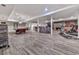 Finished basement featuring a pool table, bar, fireplace, and gym equipment at 329 Lakebridge Xing, Canton, GA 30114