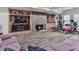Finished basement with a fireplace, a built in bookshelf, and gym equipment at 329 Lakebridge Xing, Canton, GA 30114