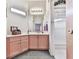 Bathroom featuring pink wood cabinets, white countertops and a shower with white tile at 329 Lakebridge Xing, Canton, GA 30114