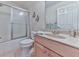 Bathroom with updated shower, modern fixtures, vanity, and neutral color palette at 329 Lakebridge Xing, Canton, GA 30114