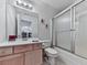 Bathroom with sleek vanity, modern mirror, and updated shower at 329 Lakebridge Xing, Canton, GA 30114