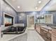 Luxurious bathroom features a black soaking tub with a built-in fireplace and elegant vanity with dual sinks at 329 Lakebridge Xing, Canton, GA 30114