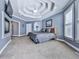 Calming bedroom showcases a tray ceiling, fireplace, natural lighting, and neutral tones at 329 Lakebridge Xing, Canton, GA 30114