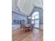 Bright dining room features hardwood floors, high ceilings, and a large window for ample natural light at 329 Lakebridge Xing, Canton, GA 30114
