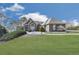 Well-maintained home with lush lawn, manicured bushes, and a stone walkway leading to the front entrance at 329 Lakebridge Xing, Canton, GA 30114