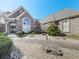 Brick home with manicured front yard, arched entrance, large window, and stone walkway at 329 Lakebridge Xing, Canton, GA 30114