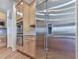 Modern kitchen features stainless steel appliances and custom wood cabinetry with a double oven and large refrigerator at 329 Lakebridge Xing, Canton, GA 30114
