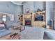 Cozy living room features a fireplace, custom shelving, and a comfortable seating area with plenty of natural light at 329 Lakebridge Xing, Canton, GA 30114