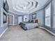 Spacious main bedroom with tray ceilings, a fireplace and ensuite access at 329 Lakebridge Xing, Canton, GA 30114