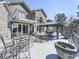 Expansive patio features outdoor dining and lounging, set against the backdrop of a brick home at 329 Lakebridge Xing, Canton, GA 30114