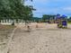 Fun playground featuring slides, swings, and climbing structures for ' enjoyment at 329 Lakebridge Xing, Canton, GA 30114