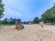 A community playground with a slide, swings, and other play equipment at 329 Lakebridge Xing, Canton, GA 30114