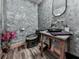 Stylish powder room features custom sink with gray textured walls at 329 Lakebridge Xing, Canton, GA 30114