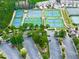 An aerial view showcases the community's blue and green tennis courts with ample parking at 329 Lakebridge Xing, Canton, GA 30114