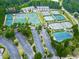 Aerial view showcasing the community's many tennis courts, surrounded by lush green trees at 329 Lakebridge Xing, Canton, GA 30114