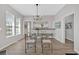 Dining room area with modern light fixture, grey walls, and natural light from windows at 345 Wellington Sw St, Atlanta, GA 30310