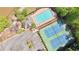 An aerial view of a pool, tennis courts, parking lot, and a playground at 5819 Rue Chase Way, Tucker, GA 30084
