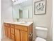 Bathroom featuring double vanity, framed mirror and white tile flooring at 5819 Rue Chase Way, Tucker, GA 30084