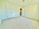 Cozy bedroom with neutral carpet, double closets and white doors at 5819 Rue Chase Way, Tucker, GA 30084