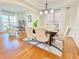 Elegant dining room with hardwood floors, stylish chairs, and plenty of natural light at 5819 Rue Chase Way, Tucker, GA 30084