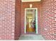 Entryway with hardwood floors and a glimpse into the living spaces at 5819 Rue Chase Way, Tucker, GA 30084
