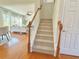 Welcoming foyer with hardwood floors and a staircase leading to the upper level at 5819 Rue Chase Way, Tucker, GA 30084