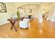 Living area with hardwood floors and a glimpse into the dining room at 5819 Rue Chase Way, Tucker, GA 30084