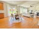Open-concept living area features hardwood floors, neutral decor, and lots of natural light at 5819 Rue Chase Way, Tucker, GA 30084