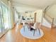 Open-concept living room and staircase with hardwood floors and bright, neutral decor at 5819 Rue Chase Way, Tucker, GA 30084