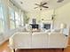 Bright living room with fireplace, plush seating, and large windows at 5819 Rue Chase Way, Tucker, GA 30084