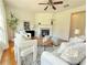 Cozy living room with white furniture, modern decor, and a fireplace at 5819 Rue Chase Way, Tucker, GA 30084