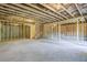 Unfinished basement space featuring exposed wooden beams and a concrete floor at 146 Silver Leaf Trce, Douglasville, GA 30134