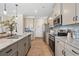 Modern kitchen with stainless steel appliances, granite countertops, subway tile backsplash, and pendant lighting at 146 Silver Leaf Trce, Douglasville, GA 30134