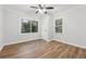 Bedroom with wood flooring, a ceiling fan, and natural light offers a comfortable and neutral space at 1849 S Columbia Place, Decatur, GA 30032